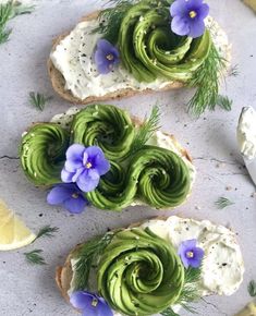 three pieces of bread with green and purple flowers on them