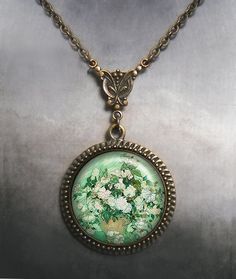 "Van Gogh's gorgeous rose painting is used in an Art Nouveau inspired necklace design. (Listing 84) The pendant measures 1-3/16\" across (30mm) and the artwork is covered by a crystal clear, domed glass cabochon which protects and enhances the image -- a truly beautiful effect! The chain fastens with a toggle clasp and it's available in 5 lengths, 18\", 21\", 24\", 27\" and 30\". You'll choose your length at checkout, and if you need it longer or shorter, please let us know. These necklaces ship Green Jewelry Gift With Rose Design, Green Rose Design Jewelry For Gift, Green Jewelry With Rose Design For Gift, Artistic Flower Pendant Necklaces For Gifts, Artistic Green Necklace For Gift, Artistic Necklaces For Mother's Day Gift, Van Gogh Roses, Moon Goddess Jewelry, Moon Goddess Necklace