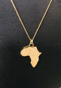 2FOR1!- 18K Gold Continent of Africa Pendant- PENDANT ONLY- Country Pendant- Perfect Gift- Country Charm- Stylish- Africa Map- Jewelry- [Eze Fashion] + FREE DOMESTIC SHIPPING ANYWHERE IN THE USA PENDENT DIMENSIONS: 28.36X22.33cmX1cm  ------------------------------------------------------------------------------------------------------ Purchase Includes:  (1) Black Velvet Suede Jewelry Pouch (2 FOR PRICE OF 1!) 18K Gold African Map Pendant   MATERIAL: High-quality anti-rusting 18K gold plating. No need to take it off! Wear it anywhere and guaranteed not to rust or wear! This Eze (meaning royalty) necklace works great for any occasion: Casual, Party, Prom, Class, Bar, office, school, dating wearing fashion jewelry. Africa Map Pendant Necklace for Women/Men Platinum Plated Ethiopian Jewelry W Africa Pendant, Ethiopian Jewelry, Suede Jewelry, African Map, Map Jewelry, Map Pendant, Map Necklace, Africa Map, Country Charm