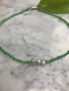 This necklace was handmade by me. It was inspired by earth day, with the green beads around the choker. Adjustable Green Pearl Necklace, Adjustable Handmade Green Pearl Necklace, Green Pearl Jewelry With Tiny Beads, Bead Choker, Green Beads, Pompano Beach, Choker Necklaces, Beaded Choker, Green Bead