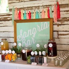 there is a sign that says sangria bar on the table