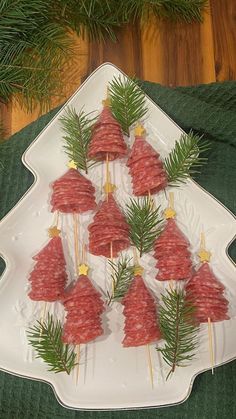 a platter filled with meat and pine cones