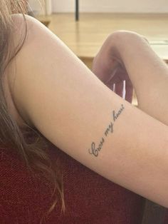 a woman with a tattoo on her arm that says, you are my forever and i love you