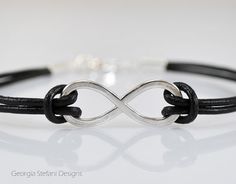 Unisex Sterling Silver Infinity Leather by DreamCityJewels on Etsy Personalized Elegant Leather Bracelet As Gift, Personalized Elegant Leather Bracelet Gift, Elegant Personalized Leather Bracelet For Gift, Elegant Personalized Leather Bracelet Gift, Elegant Personalized Silver Leather Bracelet, Elegant Adjustable Leather Bracelet For Anniversary, Elegant Adjustable Leather Bracelet For Father's Day, Elegant Silver Leather Friendship Bracelet, Elegant Adjustable Jewelry For Father's Day