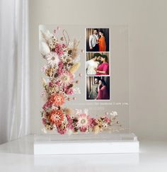 an acrylic photo frame with flowers on it