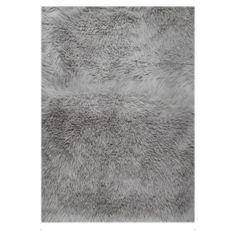 a gray area rug with shaggy fur on the bottom, and an image of a white background