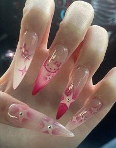 a hand with pink and white nail designs on it