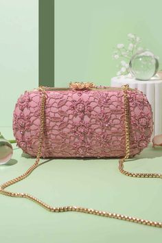 "Featuring our stunning pink lace cutwork clutch, adorned with delicate, pink-toned beads and cutdana adding an extra touch of elegance and charm. The beautiful cutwork adds depth and dimension to the clutch by allowing a glimpse of the lining beneath. Wear it gracefully on your shoulder allowing it to drape elegantly by your side for a sophisticated look or you can carry it in your hands for a more classic look. Color: Pink Dimensions (LxB): 8\"x4\" (20.3 cm X 10.1 cm) Handle length: 47\" (120 cm) Handle drop: 23\" (58 cm) Material: Lace cutwork fabric, suede lining, golden metal clutch frame, golden metal sling. Features: metal lock closure, detachable metal sling." Bridal Clutch Bag, Wedding Clutch, Bridal Clutch, Family Event, Evening Clutch Bag, Evening Clutch, Party Bags, Look Plus, Etsy Fashion