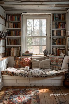 a living room filled with lots of furniture and bookshelves next to a window