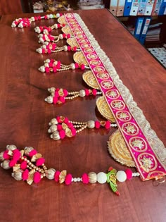 the table is covered with pink and white beads