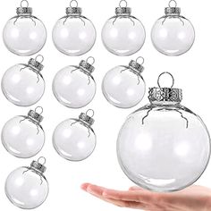 twelve clear glass baubles with silver trimmings on each ornament