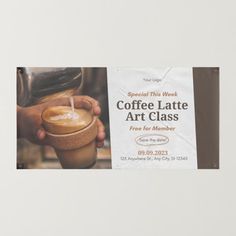 coffee latte art class sign hanging on the wall in front of a white background