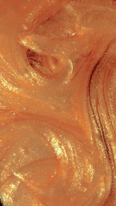 an orange substance that looks like it is swirling