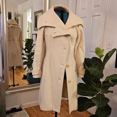 Beautiful Wool Coat In Classic A Line Swing Design. Attention To Details You Rarely See Anymore. Option To Tighten Back With Extra Buttons And Multiple Collar Styling Options Fitted White Wool Coat For Work, Classic Fitted Cream Wool Coat, Chic Fitted Winter White Outerwear, White Fitted Pea Coat For Work, Fitted Beige Wool Coat For Spring, Fitted Cream Pea Coat For Work, White Fitted Pea Coat For Fall, Fitted White Pea Coat For Fall, Classic Fitted Cream Pea Coat