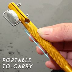 a person holding a yellow toothbrush in their left hand with the words portable to carry on it