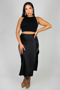 Elevate your style with our knee-length side slit satin skirt. Made from luxurious satin fabric, it offers a smooth, lustrous texture. It features a side zipper closure, and a side slit. This skirt combines elegance to any look, whether you're going for an elevated casual look or dressing for a special occasion. Embrace its timeless appeal and exude confidence with every step you take. During warmer months, style this midi skirt with heels or sandals. Transition into cooler month effortlessly wi Satin Skirt Black, Elevated Casual, Knee High Heels, Exude Confidence, High Heel Boots Knee, Every Step You Take, Satin Skirt, High Heel Boots, Skirt Black