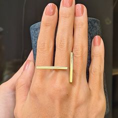 This unique, stylish Brass Double Bar Minimalist Ring will always be the center of attraction. This Open Gold Bar Ring is made of brass. This brass adjustable two bars ring is hammered, textured and polished totaly by hand carefully in our studio. Every piece in our studio is handmade which makes them unique. You will have very similar looking ring but not identical. The ring is adjustable so you can use it on your different fingers. Even so, please select your size via the drop-down menu so tha Long Bar Ring, Gold And Silver Jewelry Together Modern, Adjustable Unique Rings, Luxury Minimalist Bands For Formal Occasions, Gold Rings Two Fingers, Cheap Minimalist Metal Ring Jewelry, Luxury Minimalist Ring In Recycled Gold, Elegant Metal Midi Rings, Luxury Minimalist Rings As A Gift