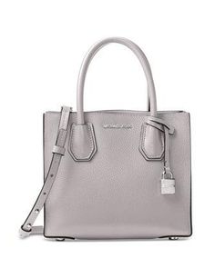 A modern silhouette and elegantly rolled handles really elevate the look of an on-the-go crossbody crafted in bonded pebble leather. A gleaming padlock charm adds signature shine.Medium sized bag; 8 1/2 W X 7 1/2 H X 4 D; (width is measured across bottom of handbag)Interior features center zip divider pocket with 1 zip pocket and 1 slip pocket inside4 1/4 Handle Drop ; Adjustable Strap: 18-20 1/2"Open topExterior features gleaming hardwaremade with classic LeatherColor: Pearl Grey Best Designer Bags, Michael Kors Mercer, Woman Bags Handbags, Leather Shoes Woman, Leather Messenger Bag, Pearl Grey, Carry All Bag, Leather Messenger, Satchel Handbags