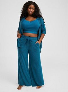 Matching Style(s): Search 40961195 FIT Model is 5'10” wearing size 0. Measures 29” inseam (size 2). MATERIALS + CARE Super Soft Plush by Torrid™️ knit fabric: A warm, breathable fabric that’s extra cozy and comfy. Stretch level: Maximum. 48% polyester, 48% rayon, 4% spandex. Machine wash cold. Line dry. . Imported. DETAILS Drawstring waistband. . Functional pockets. . Wide leg opening. . The best plus size women's super soft plush wide leg lounge pant sleep bottoms in lyons blue heather made of Comfy Lounge Pants, Cowl Neck Shirt, Wide Leg Lounge Pants, Pajamas Comfy, Perfect Pant, Comfy Pants, Cropped Cami, Matches Fashion, Drawstring Waistband