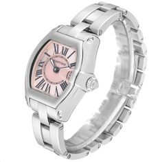 Cartier Roadster Small Pink Dial Steel Ladies Watch W62017V3. Swiss quartz movement calibre 688. Stainless steel tonneau shaped case 36 x 30 mm. . Scratch resistant sapphire crystal with cyclops magnifier. Pink sunray effect dial with black Roman numerals. Luminescent sword shaped steel hands. Date window at 3 o'clock. Stainless steel bracelet with hidden butterfly clasp, fits 6 1/4" wrist. Cartier Roadster, High End Watches, Luxury Timepieces, Vintage Rolex, Fine Watches, 3 O Clock, Magnifying Glass, Beautiful Watches, Ladies Watch