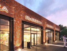 an artist's rendering of the exterior of a retail store at dusk with people walking by