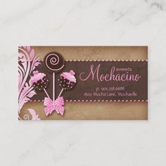 a business card with pink and brown flowers