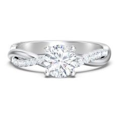 a white gold engagement ring with a twisted band and a round diamond center stone on the side