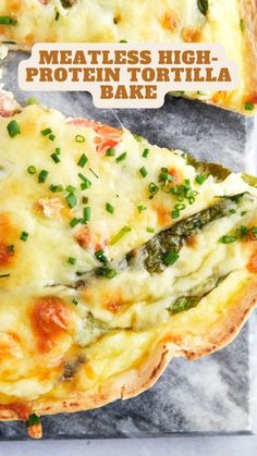 there is a pizza with cheese and asparagus on the top, next to a piece of bread