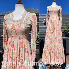 Pretty floral patchwork print on this Jody T. maxi dress.  Colors are done in beige, sage green, blue, and different shades of pink.  Square neckline with pink ribbon trim.  Long sleeves have pink ribbon trim on cuffs, and fabric covered buttons.  Pleats at front of natural waist, and ruffle hem on long skirt.  Dress zips up the back with waist ties **Very good vintage condition** Measurements: Bust 35" Natural waist 27" Length 57" **BUYER IS RESPONSIBLE FOR REVIEWING PHOTOS, AND READING DESCRIP 1970's Dresses, 70s Fashion Women, Long Skirt Dress, 70s Prairie Dress, 70s Prairie, Prairie Dresses, 70s Maxi Dress, 70s Inspired Fashion, Dress Colors