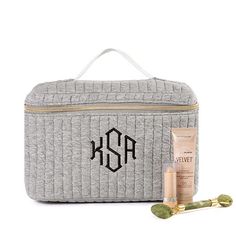 This Monogrammed Train Case is the perfect addition for all your travels! Made with high quality materials, this case is plenty durable to safely carry all your cosmetics and goes perfectly with your other personalized travel accessories! Fully lined, this bag features a zipper closure and an attached mirror on the inside of the bag.Made of quilted cotton and polyester with a PVC lining. Measures approximately 9.5 inches wide, 6.5 inches tall, and 5.5 inches deep. Features a nylon coil zipper wi Travel Cosmetic Bag With Case Included, Rectangular Travel Accessories With Zipper Closure For Personal Use, Rectangular Cosmetic Bag With Luggage Sleeve For Personal Use, Rectangular Cosmetic Bag With Case For On-the-go, Large Capacity Rectangular Cosmetic Bag For Personal Use, Marley Lilly, Train Case, Travel In Style, Custom Quilts