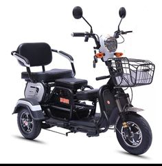 an orange and black scooter with a basket on the front wheel, against a white background