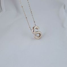 "🌟 Welcome to the world of elegance and individuality with our stunning Balloon Letter S Necklace! 🌟 ✨ Elevate your style and make a statement that's uniquely you with this exquisite pendant necklace. Crafted from premium Stainless Steel in a radiant silver hue, it's not just jewelry--it's a symbol of sophistication and grace. 🎈 Designed for women of all ages who cherish beauty and embrace their individuality, this necklace is more than just an accessory--it's a reflection of your inner spark Silver Letter Initial Necklace For Everyday, Silver Initial Pendant Necklace With Letter Beads, Silver Initial Necklace With Letter Beads, Minimalist Silver Necklace With Letter Beads, Silver Initial Necklace With Letter Beads For Anniversary, Sterling Silver Initial Necklace With Letter Beads, Sterling Silver Initial Necklace With Letter Beads As Gift, S Bubble Letter, Letter S Necklace