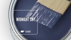 a paint can with a brush in it that says midnight sky