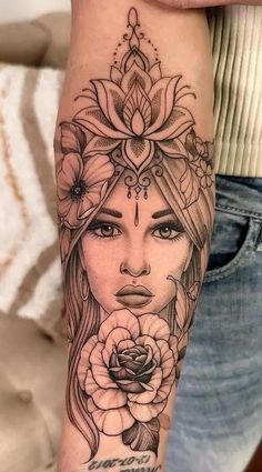 a woman's face with flowers on her arm