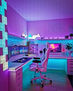 a purple and blue room with a desk, chair, computer monitor and lights in it