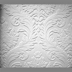 an ornate white wallpaper pattern on the side of a building