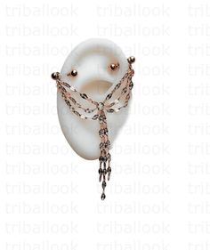 a white ring with chains and beads on it's side, in front of a white background