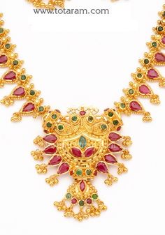 22 Karat Gold Ruby Necklace & Long Earrings set with intricate workmanship. 
  Gross Gold Weight: 38.450 - 39.450 grams
  Ruby & Emerald Weight: 10.00 Carats
  Length of Necklace with pendant : 10.00 inches 
  Length of pendant : 1.70 inches 
  Width of Pendant : 1.50 inches 
  Length of Earring : 1.25 inches
  Width of Earring : 0.75 inches
   - 235-GS1259 - in 39.450 Grams for USD $3290.69. 
Made in India by Totaram Jewelers Online this product is in Gold - 22 Karat BIS Hallmark 916 Luxury 22k Gold Temple Jewelry Emerald Necklace, Luxury Yellow Gold Temple Necklace With Ruby, Ruby Emerald Necklace, Gold Ruby Necklace, Ruby Emerald, Ruby Necklace, Emerald Necklace, Necklace Long, Long Earrings