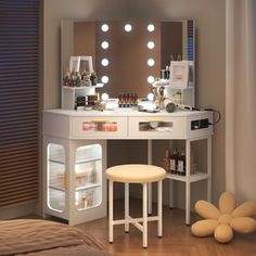 a bedroom with a vanity and stools in it