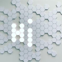 an abstract white background with hexagonal shapes and bright light coming from the center