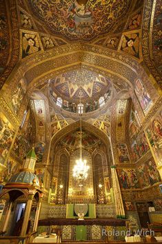 the interior of an ornate church with painted ceilings