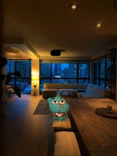 a living room filled with furniture and a large window covered in night time light fixtures