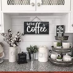 a kitchen counter with coffee mugs and other items on top of it, along with a sign that says just for the coffee