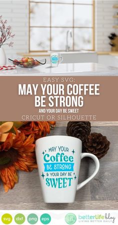 a coffee mug sitting on top of a wooden table next to flowers and pine cones