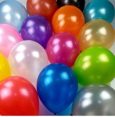 a bunch of balloons that are all different colors