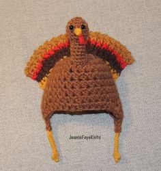 a crocheted turkey hat is laying on the floor