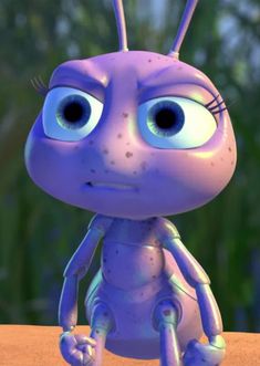 an animated purple bug with big eyes sitting on top of a table