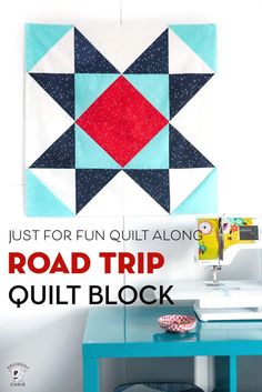 the road trip quilt block is on display in front of a blue table with a sewing machine