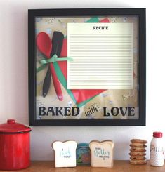 a wooden table topped with cookies and pastries next to a framed recipe book page