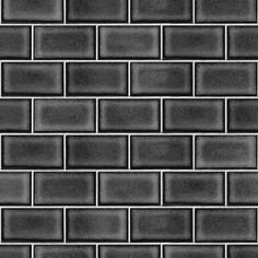 a black and white photo of a wall made out of small tiles with no one in it